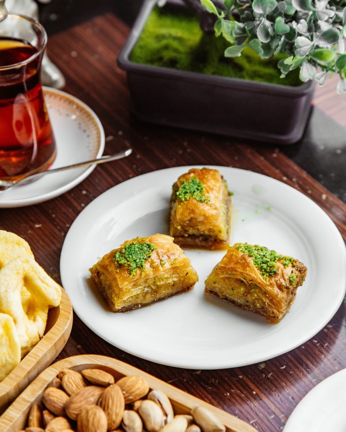 turkish baklava with nuts and a glass of tea turkish baklava with nuts and a glass of tea